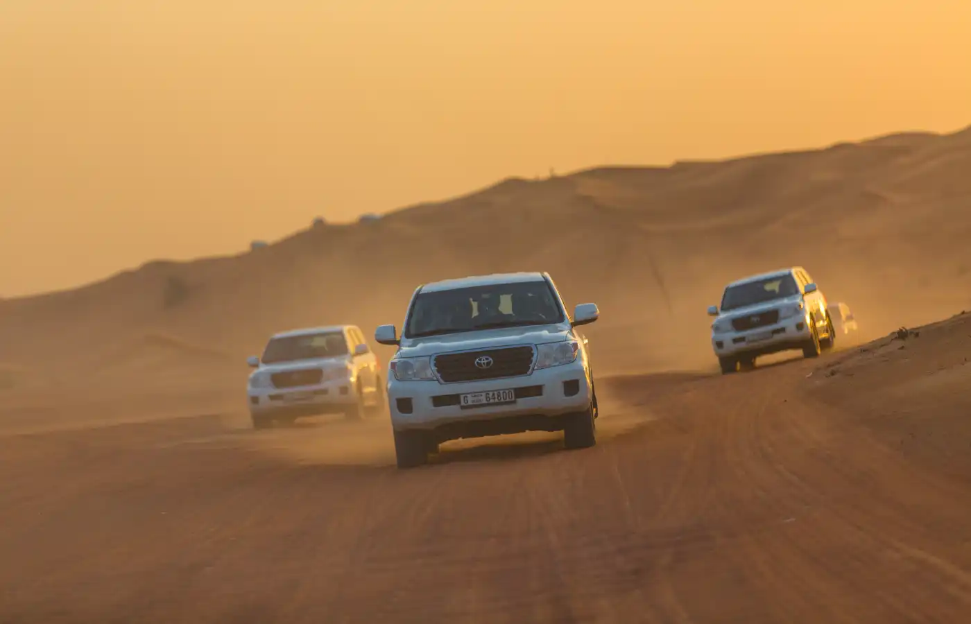 Driving on jeeps on the desert safari Dubai.