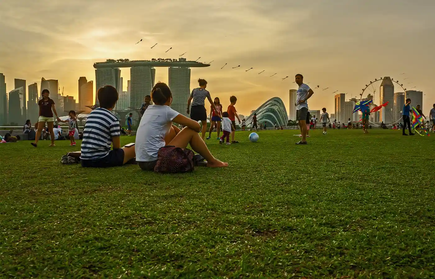 Tourists watching the sunset at Marina Barrage Singapore