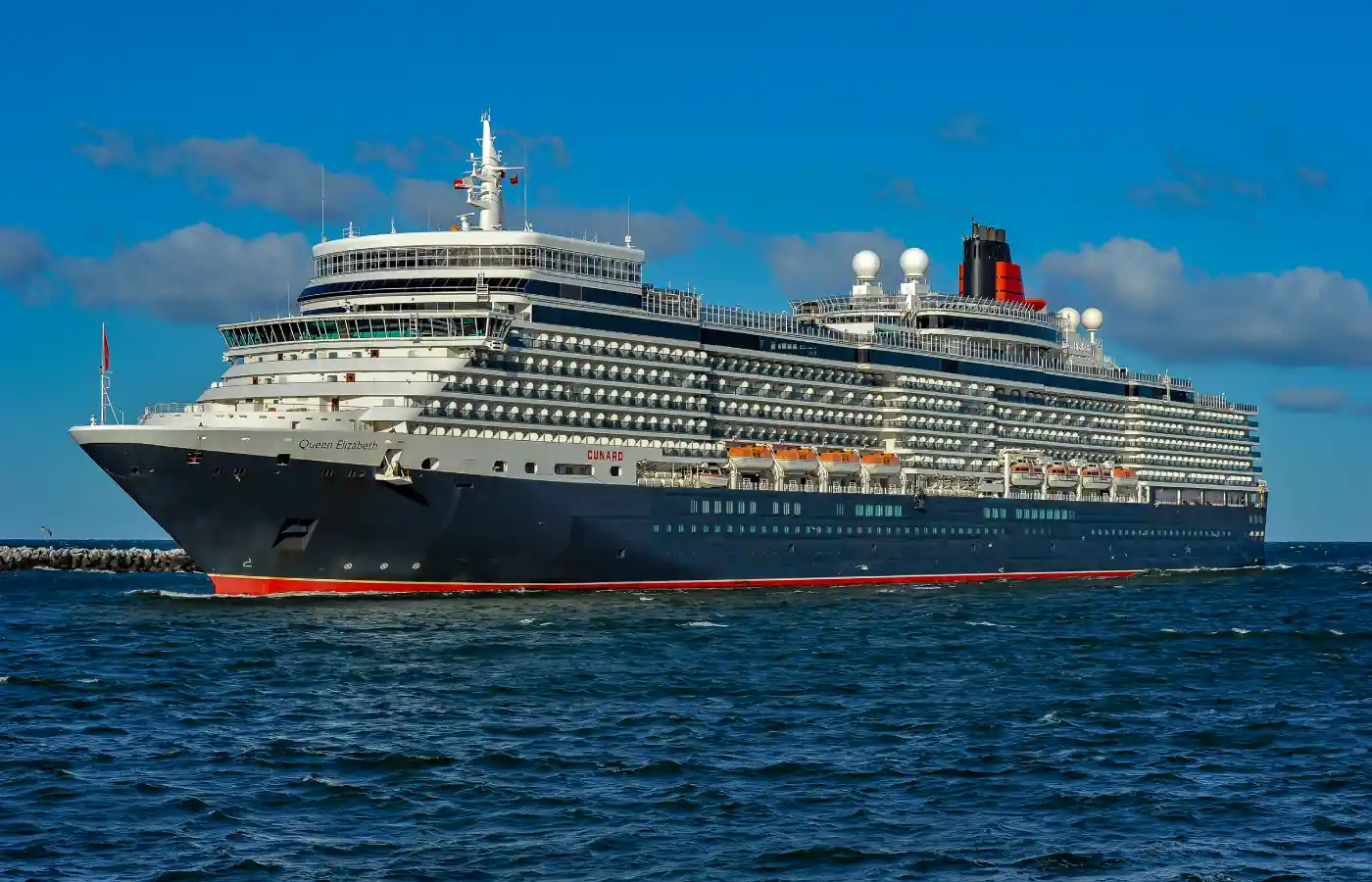 Queen Elizabeth cruise liner cruise ship in water.