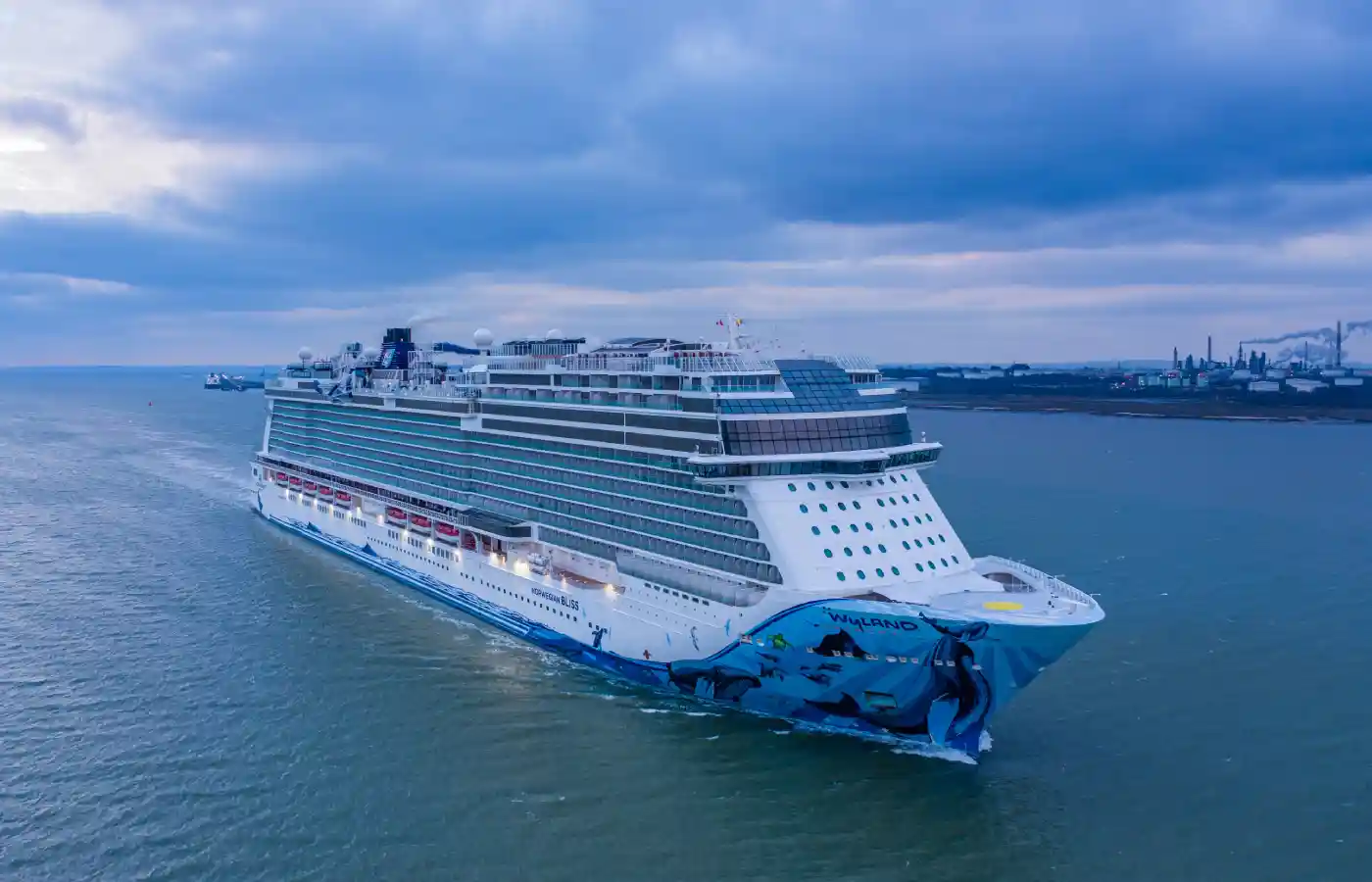 white and blue cruise ship in water body.