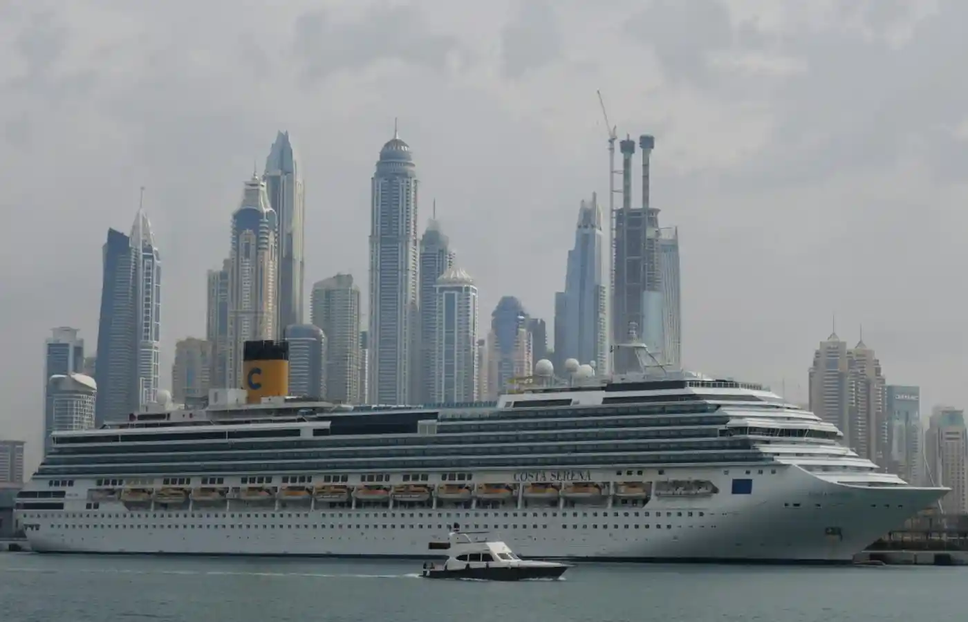 Cruise ship in city with skyscrapers