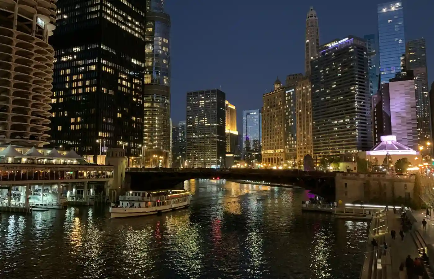 A river with a boat in it and a city in the background in USA