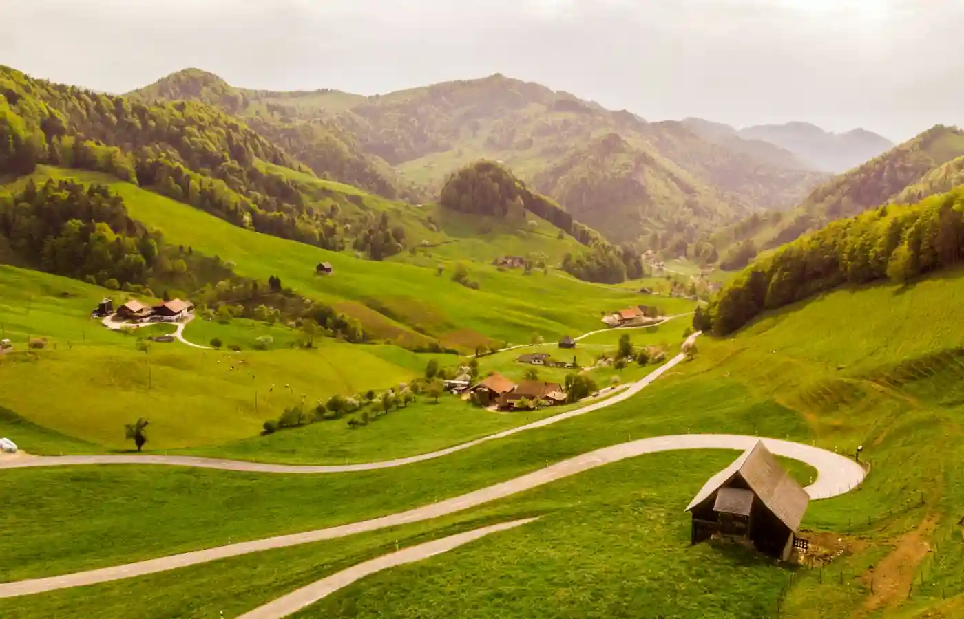Photo of house at meadow in Switzerland.
