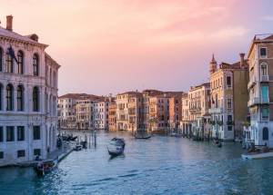 Sunset view of boats in water in Venice,Italy