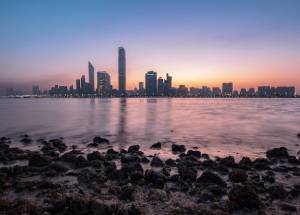 Skyscrappers near the body of water in Abu Dhabi.