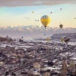 Hot Air Balloons Flying over City in Turkey.