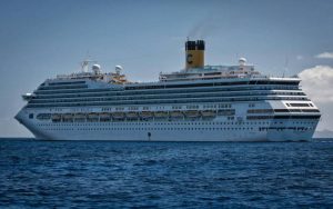 A huge cruise in the vast sea under the blue sky.