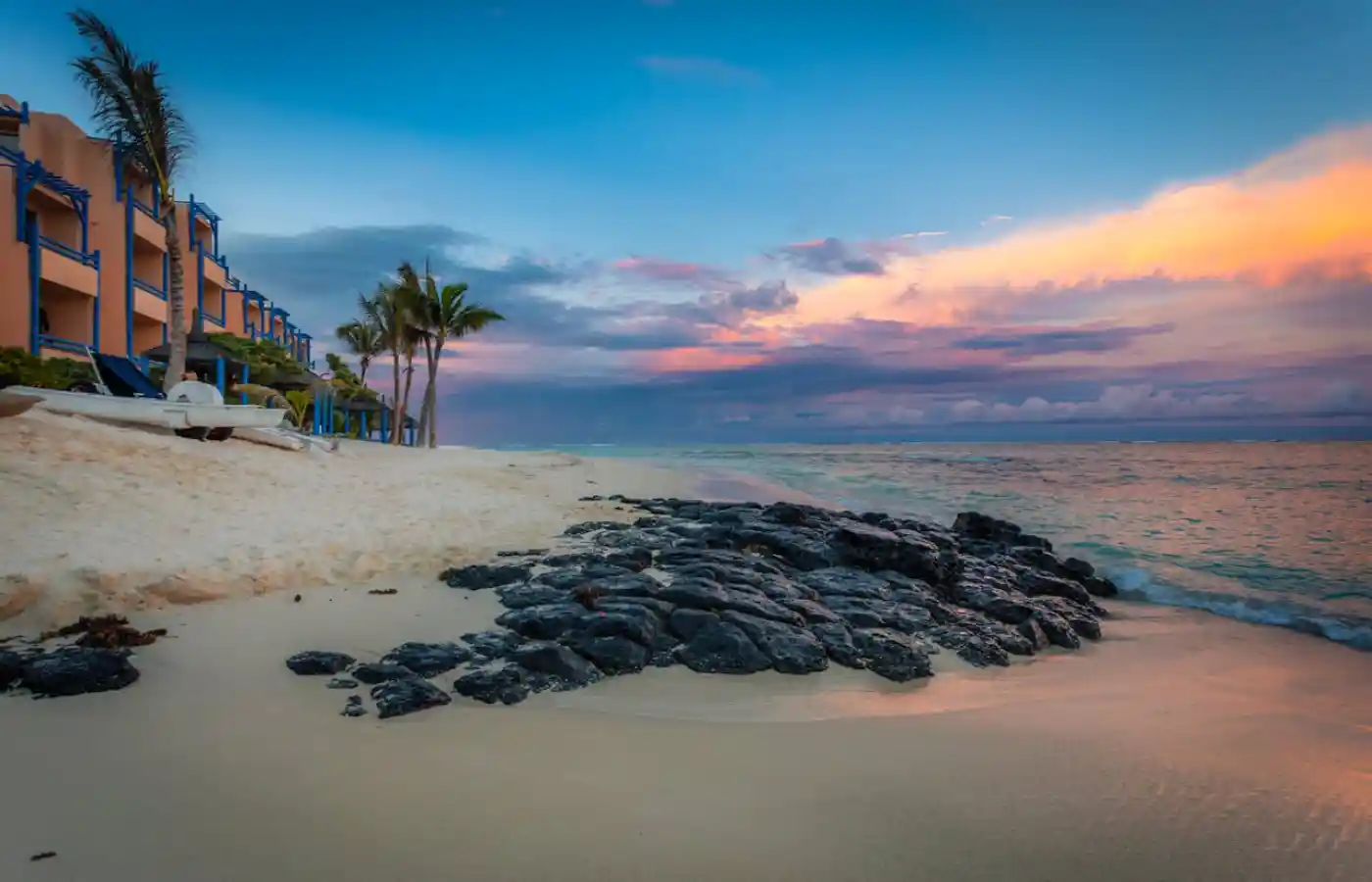 Rocks on a sea shore near a resort in Mauritius.