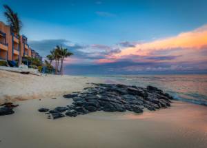 Rocks on a sea shore near a resort in Mauritius.