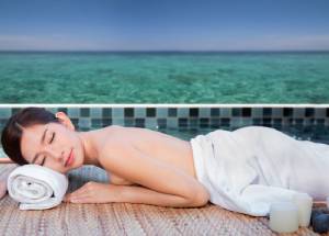 Woman enjoying spa at a luxury resort in Thailand.