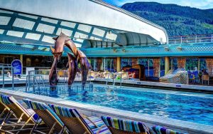 Dolphin fish at a pool in a cruise ship deck.