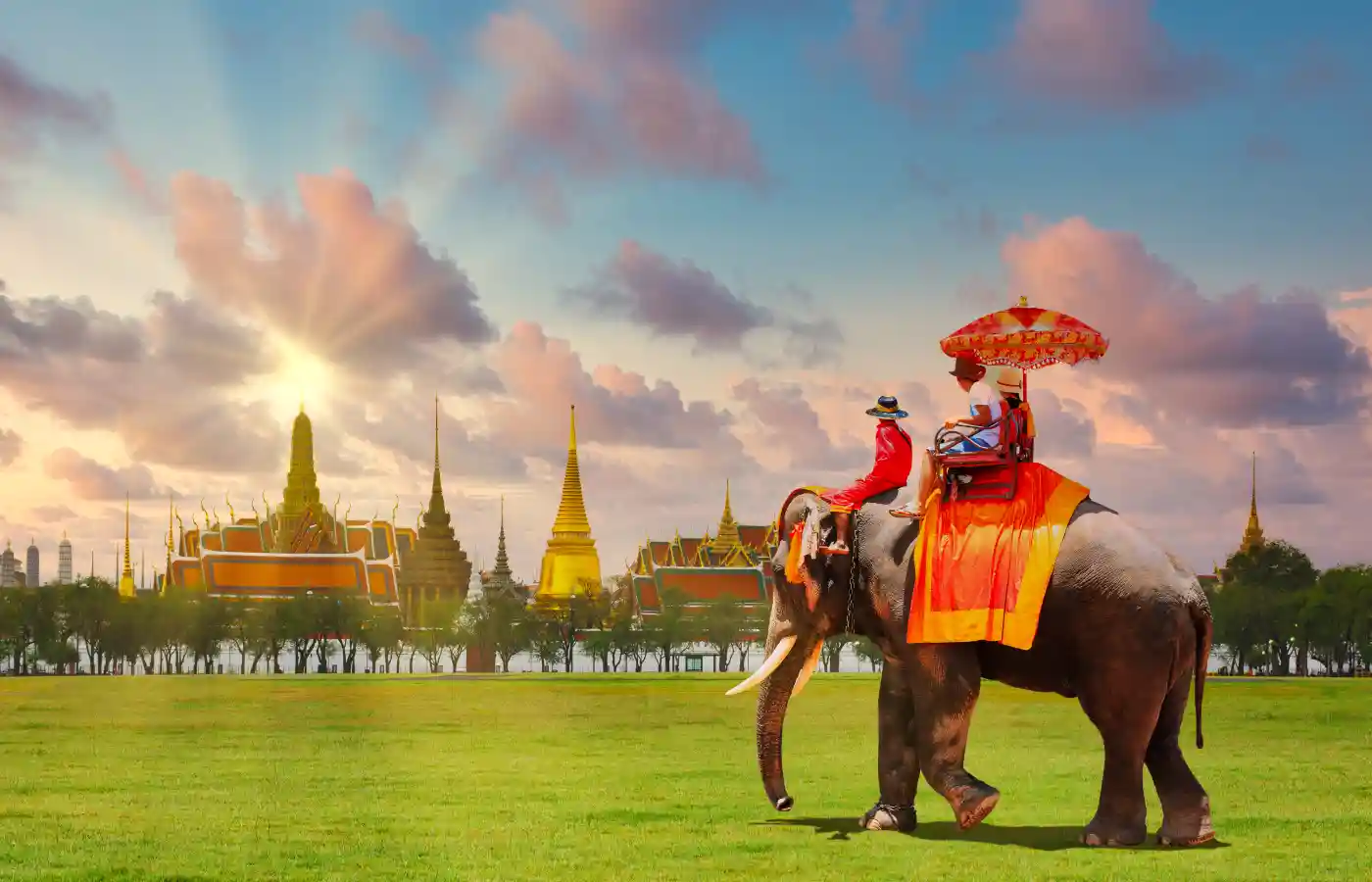 Tourists couple love on a ride elephant in Thailand.