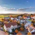 A village in Germany with small houses under the sky.