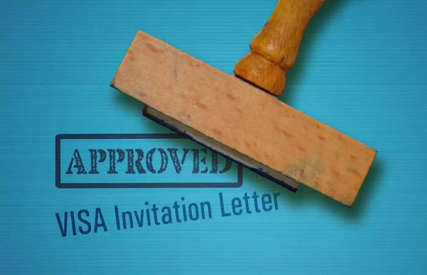 Text Visa Invitation Letter and rubber stamp on blue background.