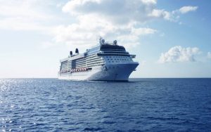 White color cruise ship in the body of water.