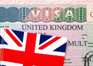 United Kingdom visa in passport with Flag of the UK.