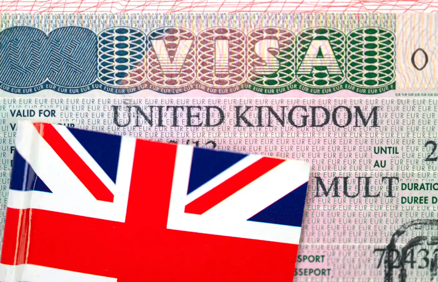 United Kingdom visa in passport with Flag of the UK.