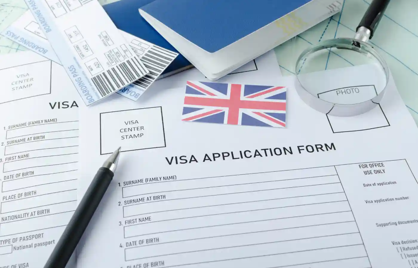 Visa application form with a pen placed upon it.