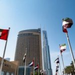 UAE flags waving besides Dubai Mall