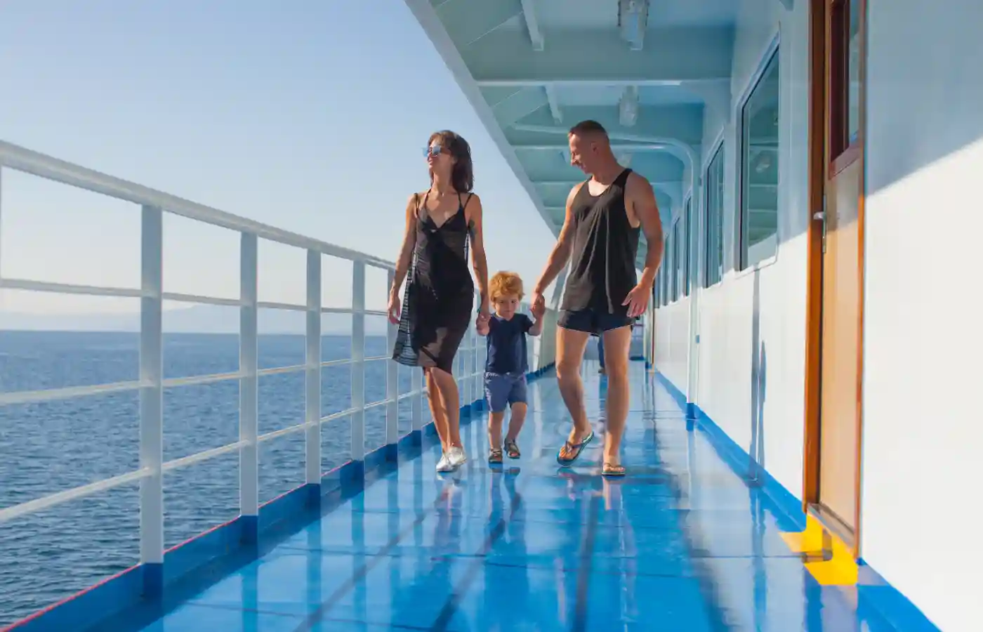 Couple on a cruise boat with their child .