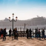 A huge white color ship at the deck.