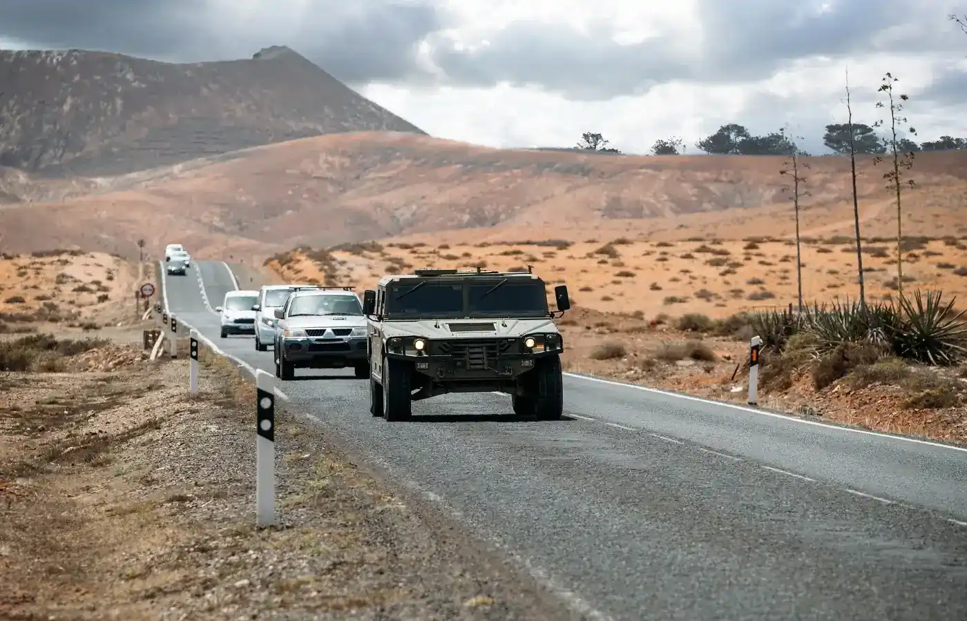 scenic view of mountains with cars