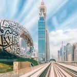 Metro railway among glass skyscrapers in Dubai.