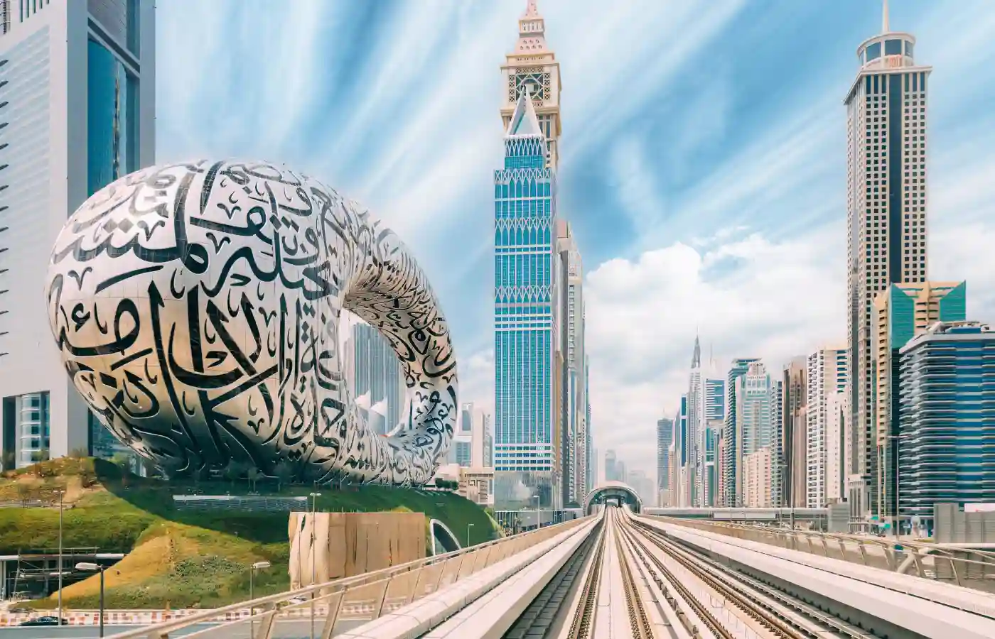 Metro railway among glass skyscrapers in Dubai.