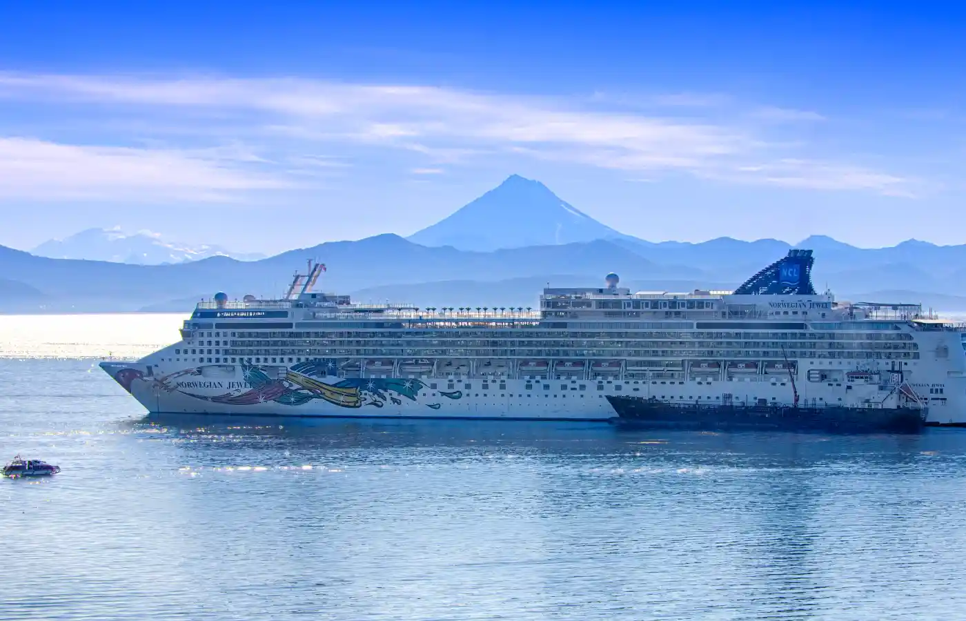 Ship cruise in the body of water.