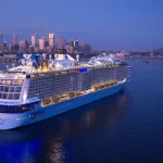 A large cruise ship in water.