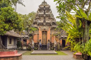 Traditional Balinese temple with intricate stone carvings and statues in Ubud, Bali