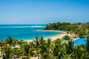 Beautiful view of a sandy beach and turquoise water in Nusa Dua, Bali