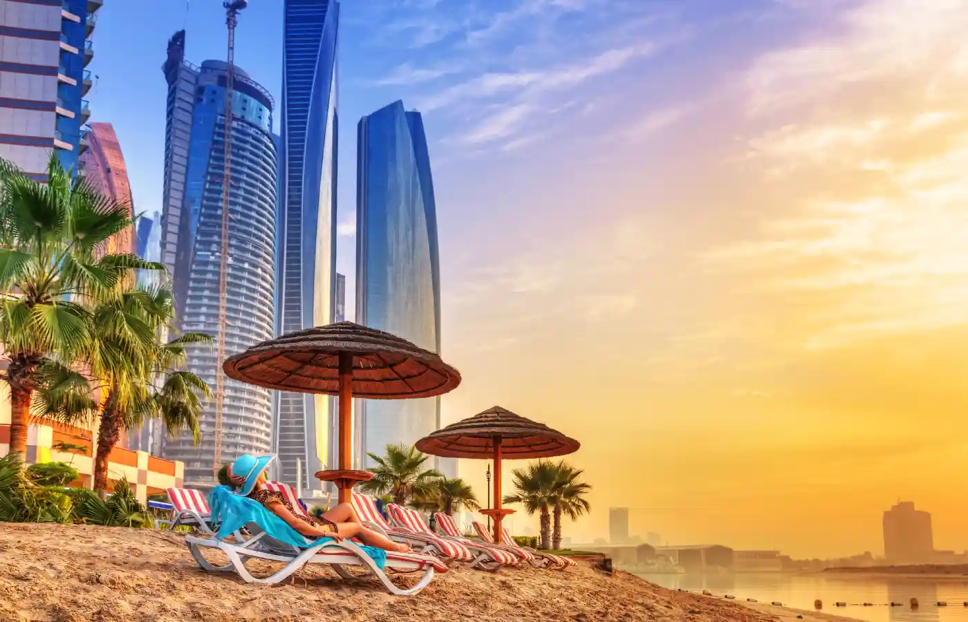 Beach at sunrise in Dubai under the sky.