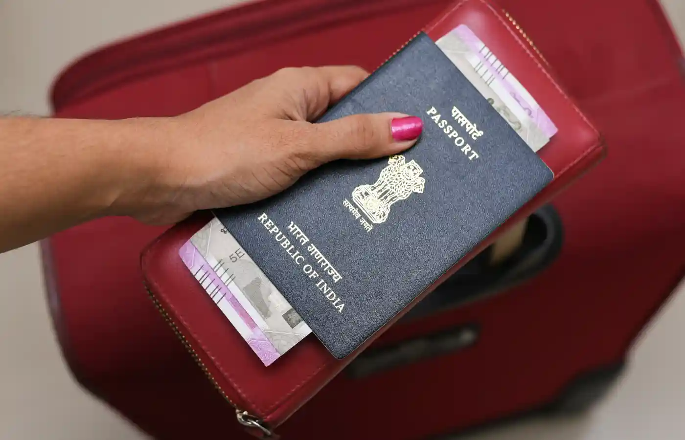 Tourist holding Indian Passport.