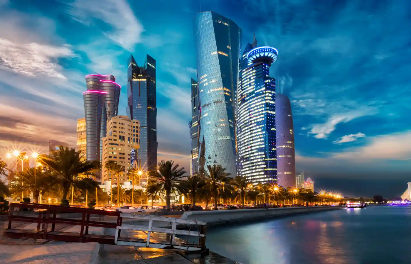 The skyline of Doha city center after sunset, Qatar