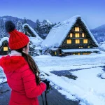 Woman exploring snowy Village