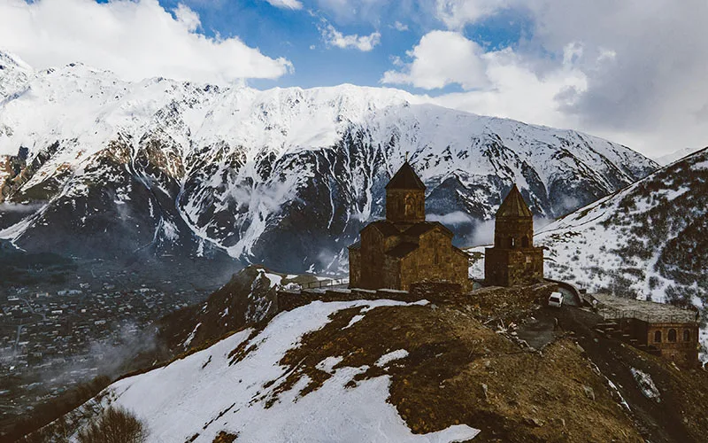Snowy mountain with church in Georgia
