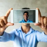 man taking photo of himself