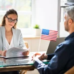 man sitting for US visa interview