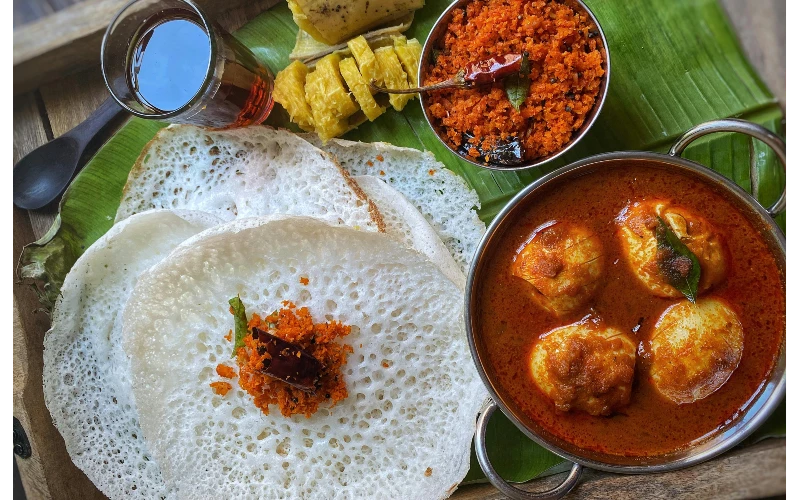 South Indian delicacy Appam with Egg Curry to be served