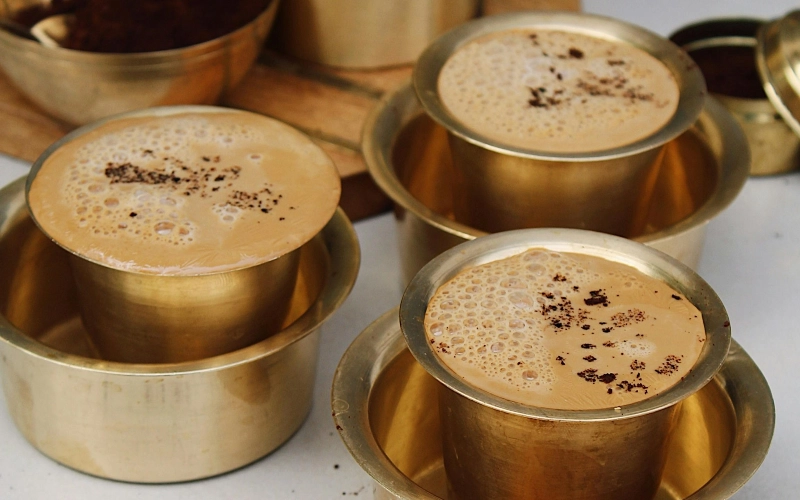 Traditional South Indian Filter Coffee served in traditional coffee tumblers to be consumed