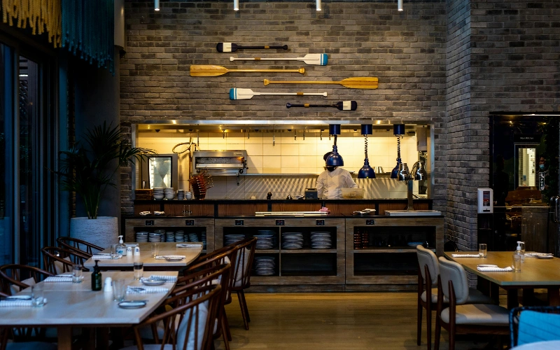 a display pic of a restaurant in Dubai with tables and chairs