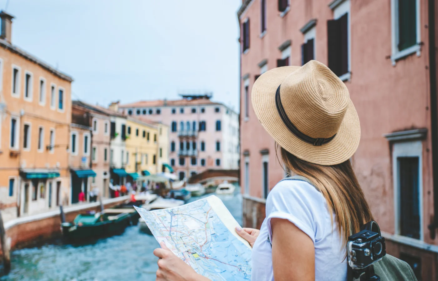 Female tourist standing on the bridge in Venice, Italy