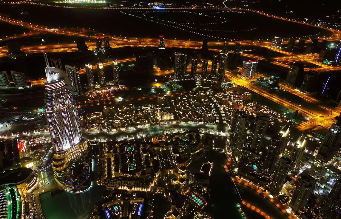 an aerial view of a glittering dubai market at night