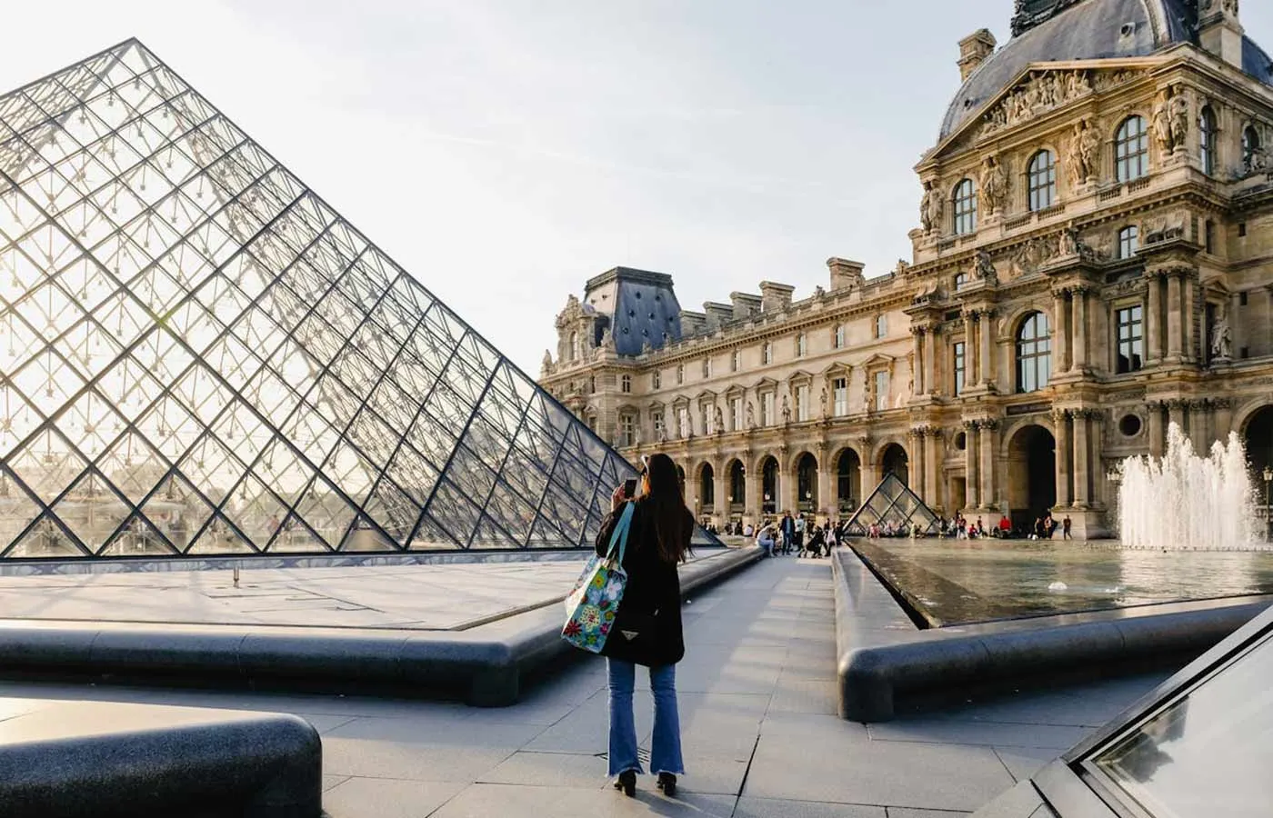 Woman taking a photo of a building