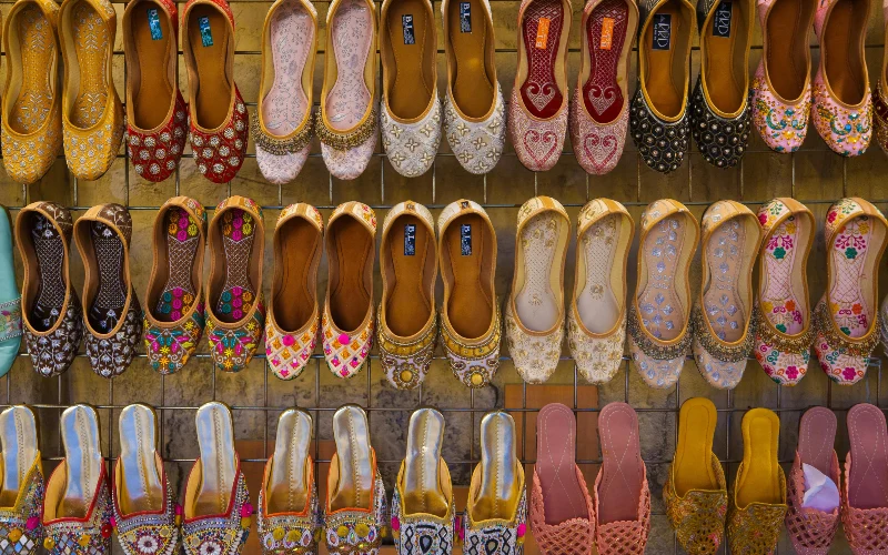 a display of colorful footware in Dubai souk, in Meena Bazaar