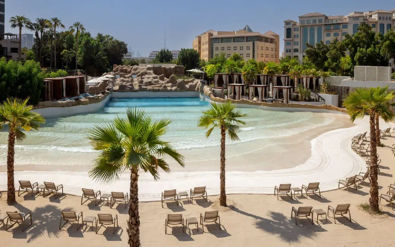 Grand Hyatt Hotel with a serene waterfront creek in Dubai