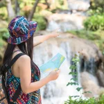 Tourists with a map enjoying their trip in Sri Lanka