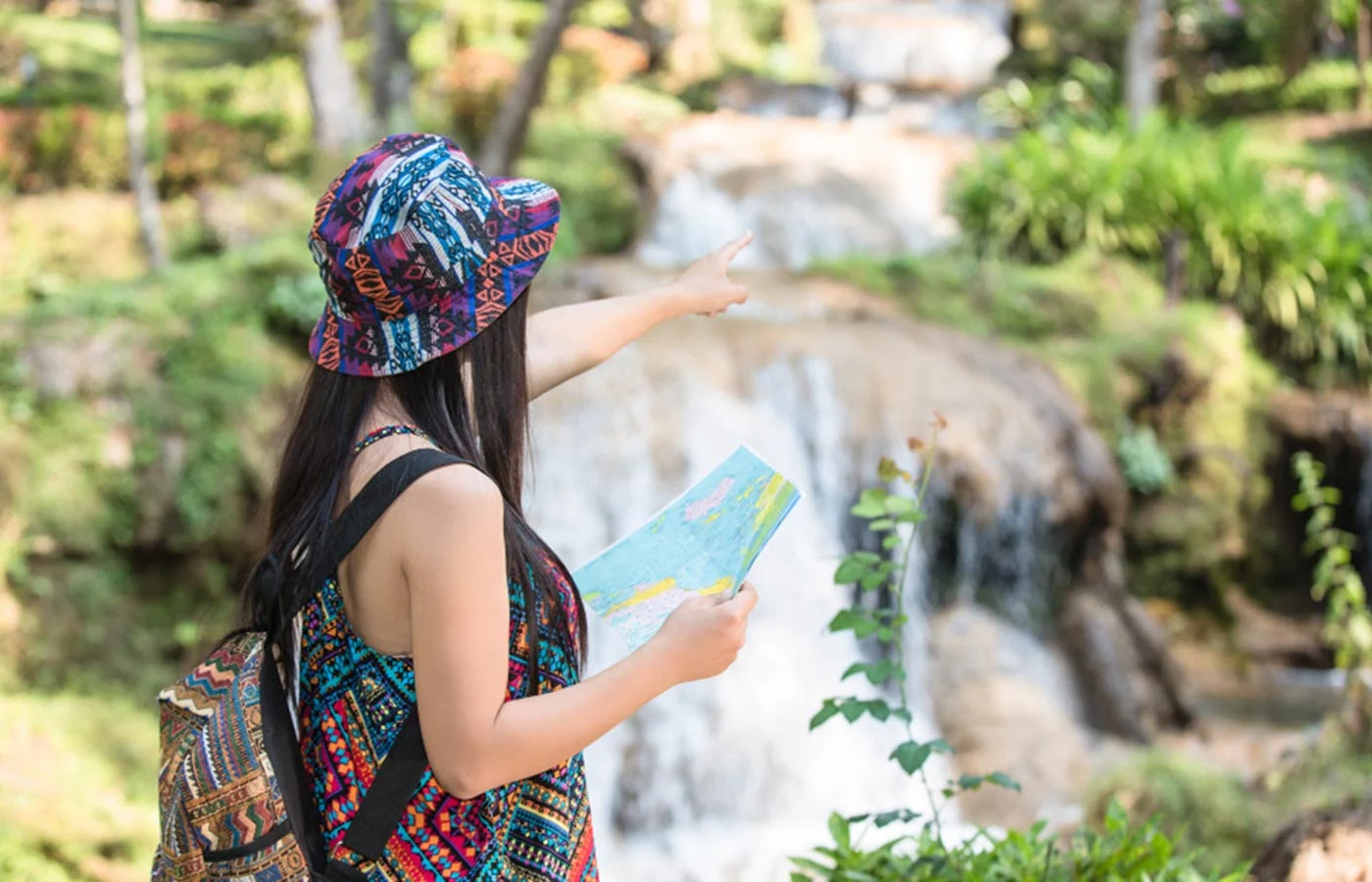 Tourists with a map enjoying their trip in Sri Lanka