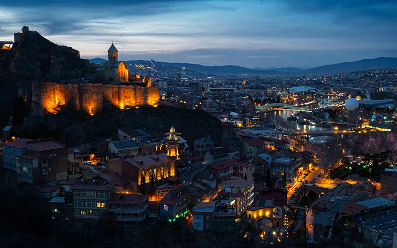 Tbilisi, Georgia city buildings at night